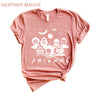 Heather-mauve-colored Funny Halloween T-Shirt. Features a 'Horror Movie Friends' print design that humorously brings together popular horror movie characters.