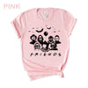 Pi̇nk-colored Funny Halloween T-Shirt. Features a 'Horror Movie Friends' print design that humorously brings together popular horror movie characters.