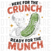 Skeleton holding a giant green pickle with text Here For The Crunch Ready For The Munch DTF transfer ready to press.